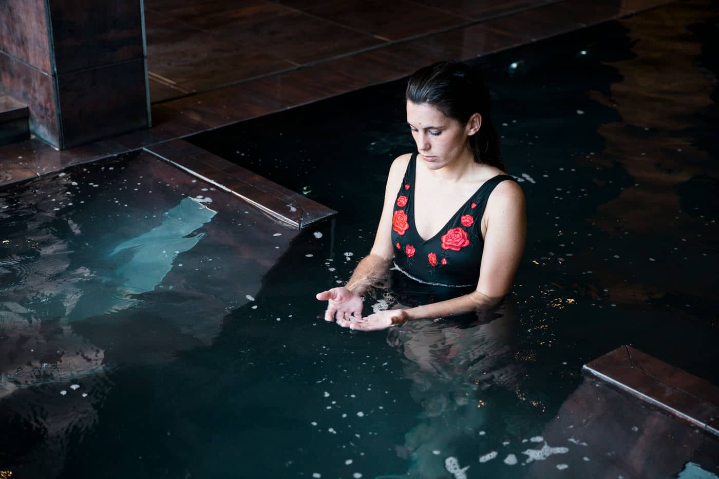 spa concept with woman relaxing water